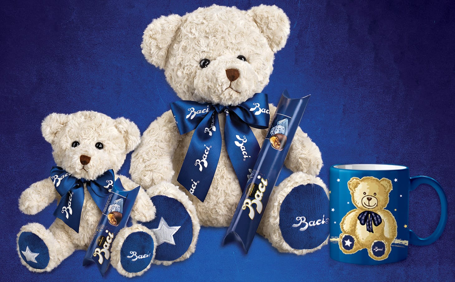 Orsacchiotto Teddy Bear bianco che regge un tubo di Baci Perugina da 42 grammi